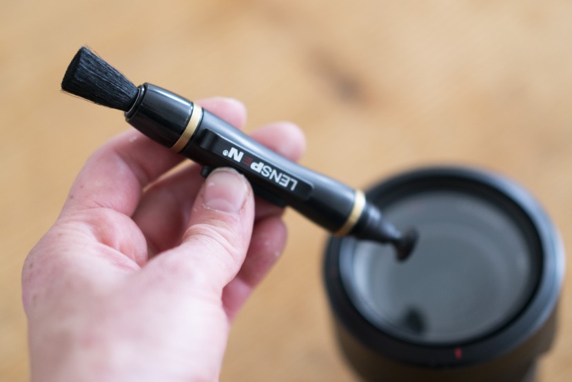 gifts for photographers - using the lenspen to clean up smudges on a lens.