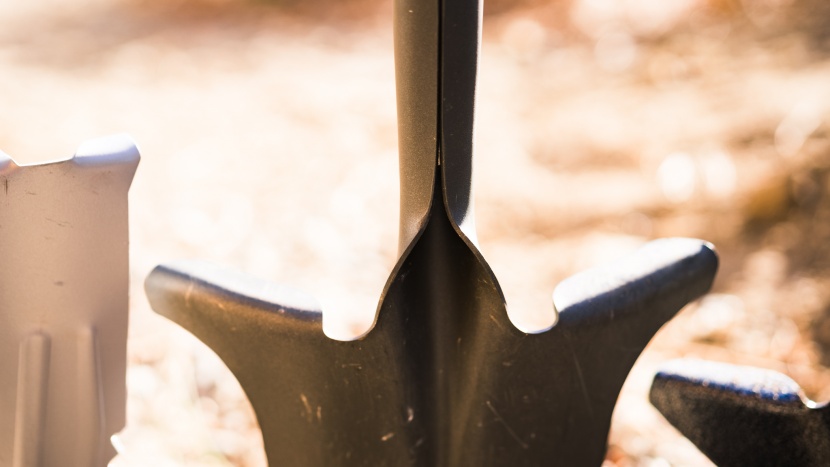 gardening shovel - though the spear head spade has a narrow blade for hacking through...