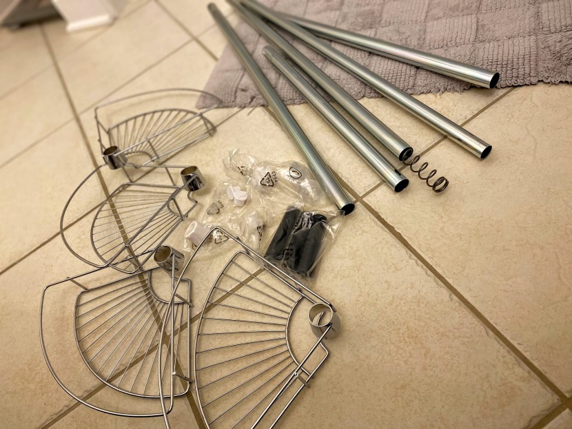 shower caddy - tension pole models come in a lot of pieces out of the box and...