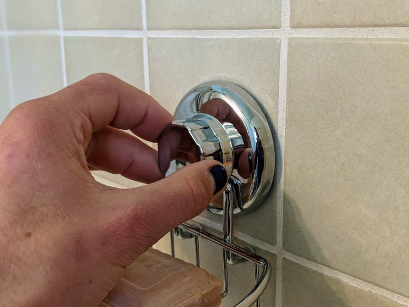 bathroom soap dish - installing one of the shower soap dishes during testing.