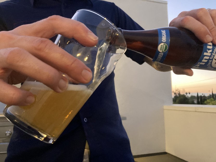 beer glasses - a tester pours into the stylish and english pint glass from luxu, a...