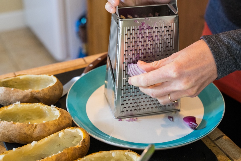grating onions results in smaller pieces that distribute flavor...