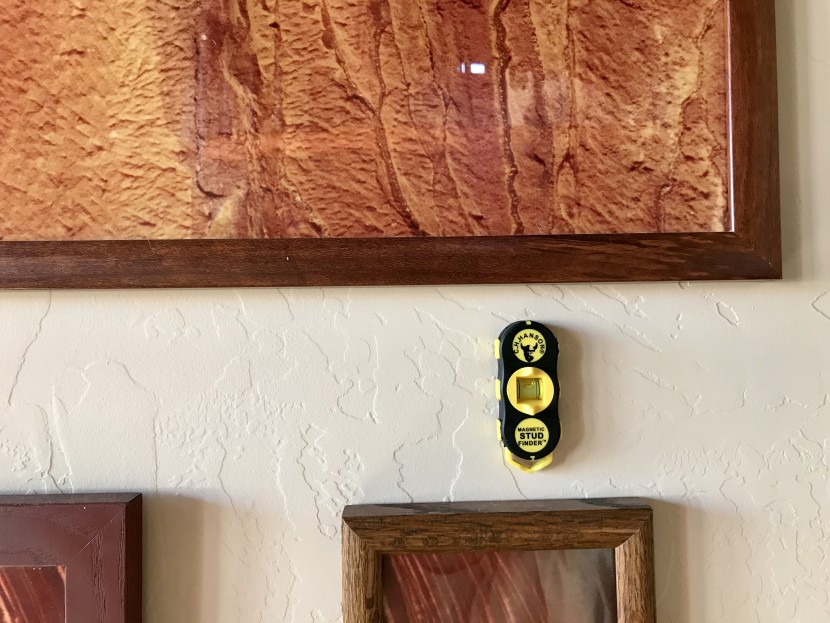 stud finder - the magnetic models were nice because they stayed on the wall once...