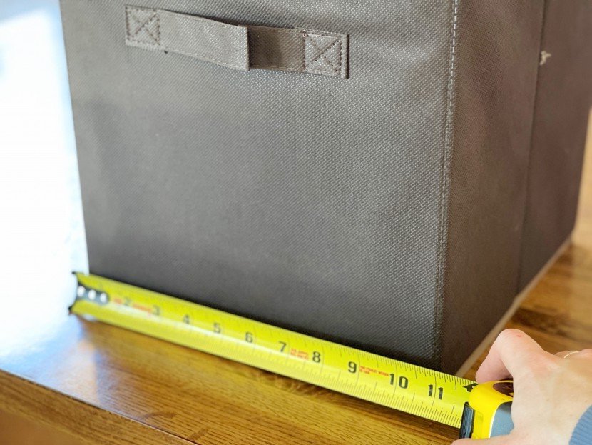 measuring the dimensions of each contender.