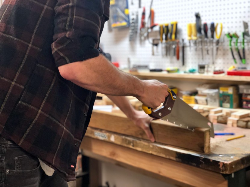 crosscutting a 2x4 as part of our testing process.