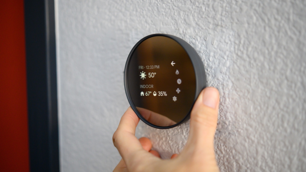 Nest Learning Thermostat Review (The Nest has a touch-sensitive strip on the side rather than a mechanical dial.)