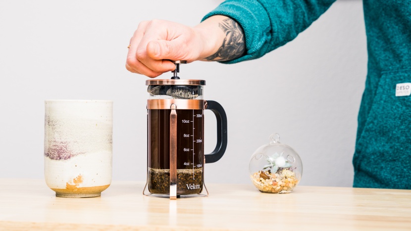 brewing coffee using a french press.