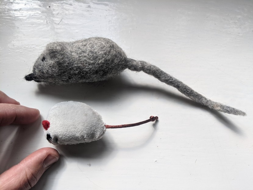 cat toys - two sizes and material types of mice are seen here, the top is a...
