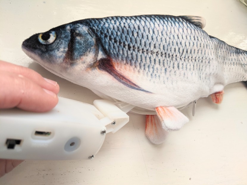 cat toys - the rechargable tail is easily inserted into the zippered pouch on...