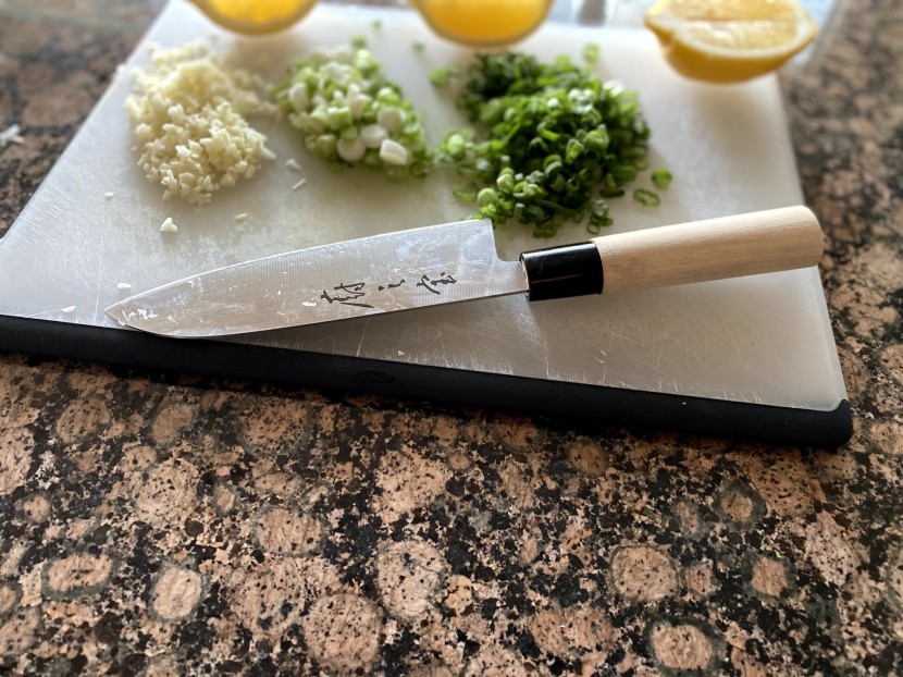 santoku knife - everything about this knife says &quot;manufactured on a budget&quot; but it...
