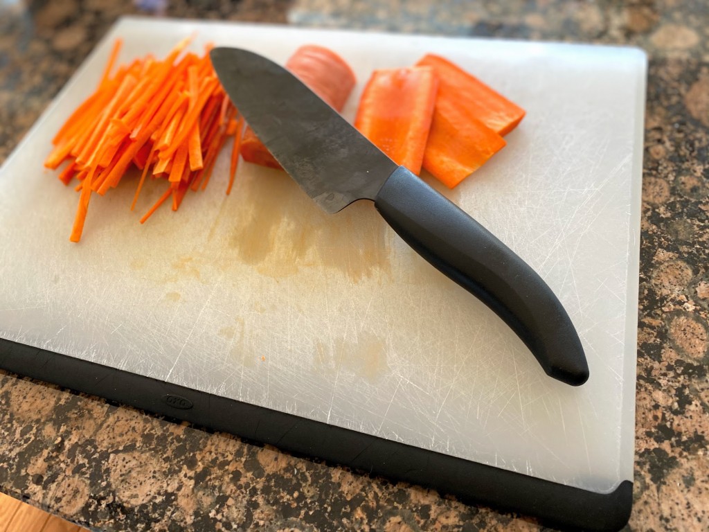 KYOCERA > The versatile nakiri gets the job done! The sharp wide blade  scoops up veggies fast!