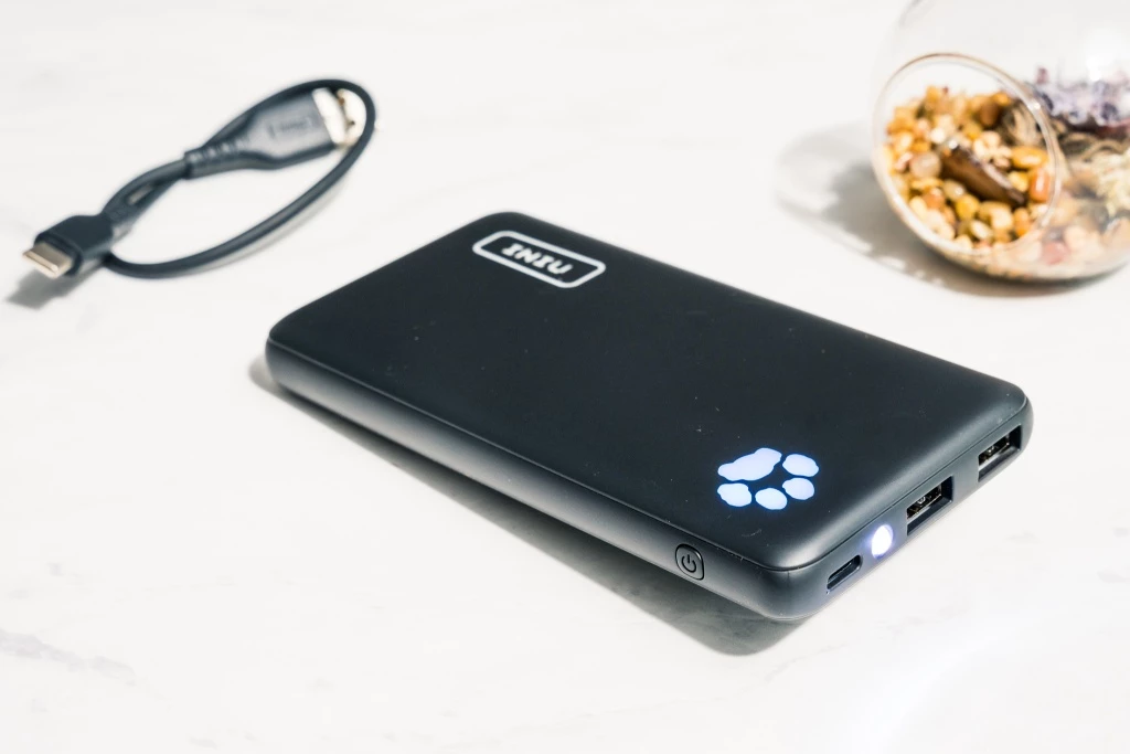 power bank - the iniu 10000 has a built-in flashlight and multiple charging ports.