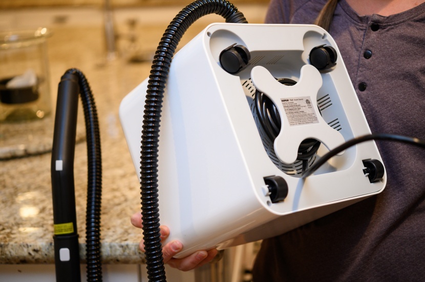 four wheels keep the massive water tank easily mobile and the cord...