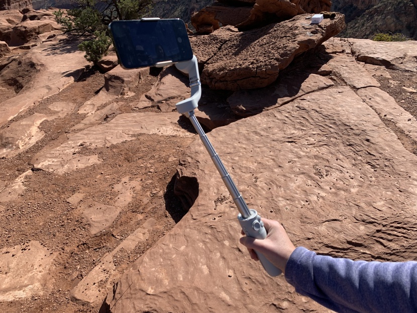 smartphone gimbal - the dji om 5 has a telescoping extendable rod integrated into the...