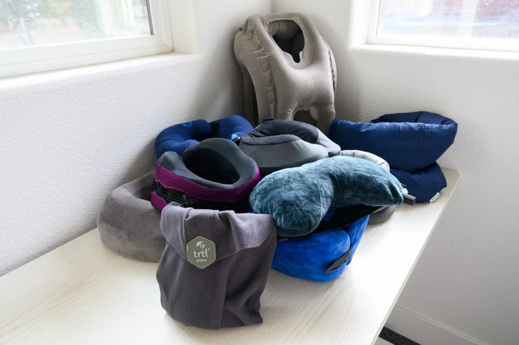 travel pillows - our team of travel experts tested a literal pile of travel pillows...