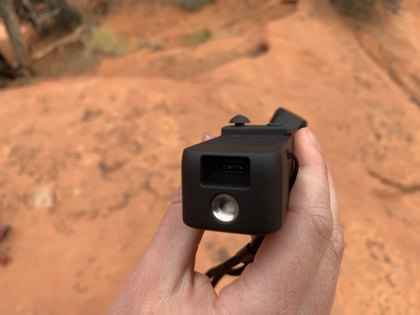 the power plug is still accessible while the tripod adapter is in use.