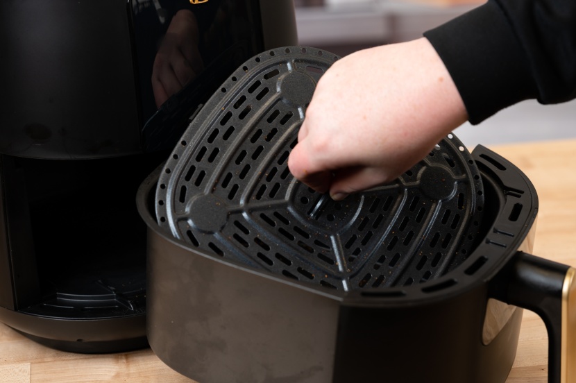 beautiful air fryer by drew barrymore - this little handle makes it easy to remove the grease tray.