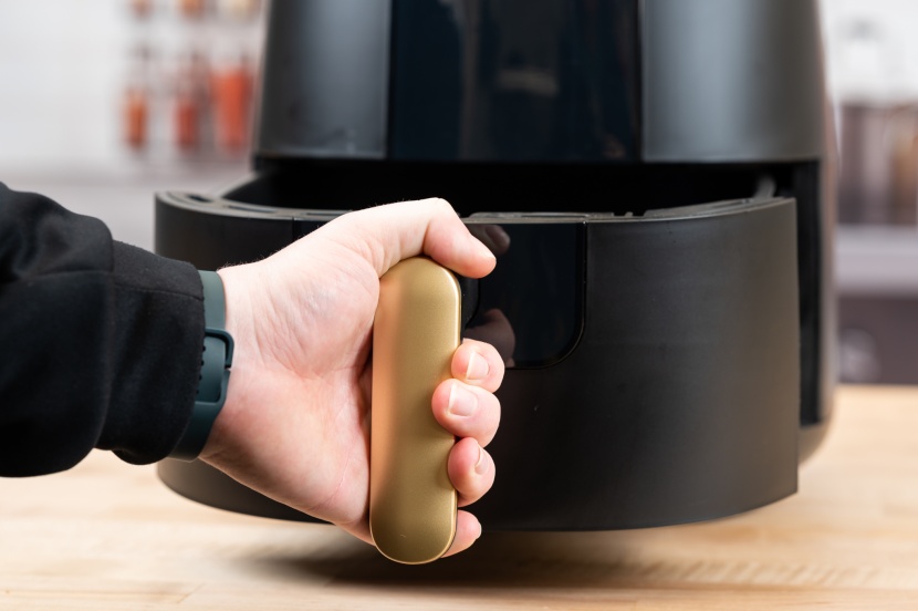 beautiful air fryer by drew barrymore - the basket glides out nicely and with minimal effort.