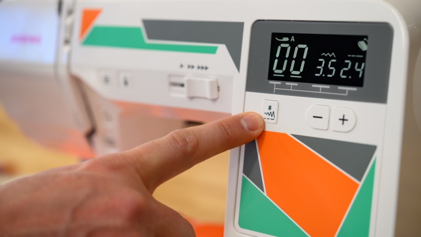 sewing machine - the mod-50 has a good-sized screen with simple to use buttons.