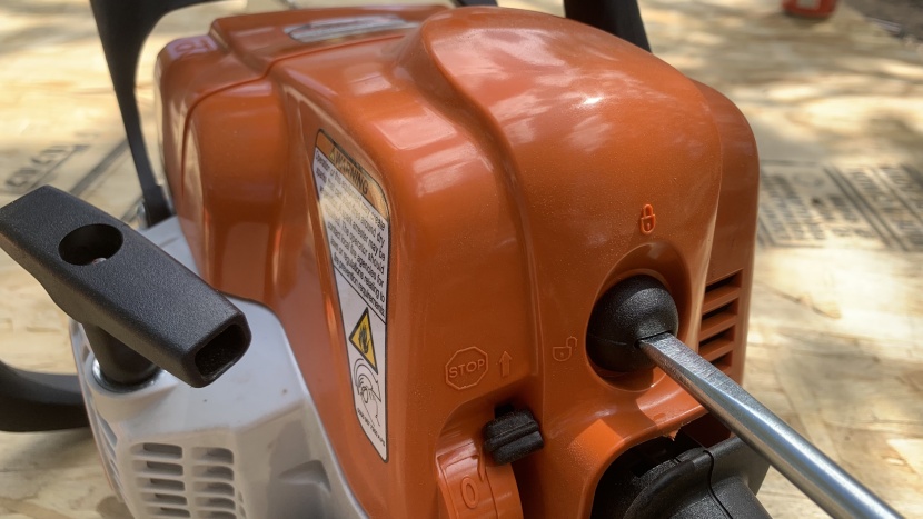 a flathead screwdriver unlocks the air filter and cylinder cover.