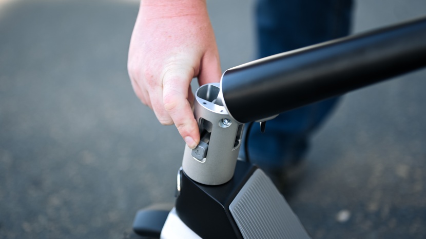 unagi model one (e500) - simply press down on the button and this lightweight scooter folds...