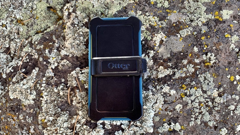the otterbox defender includes a large plastic holster that can be...