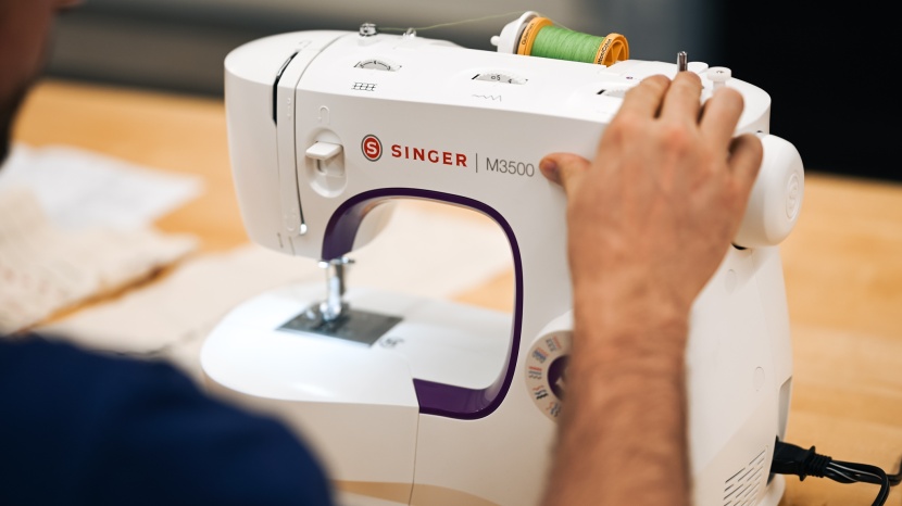 singer m3500 - three wheels on the top of the machine are what is used to select...