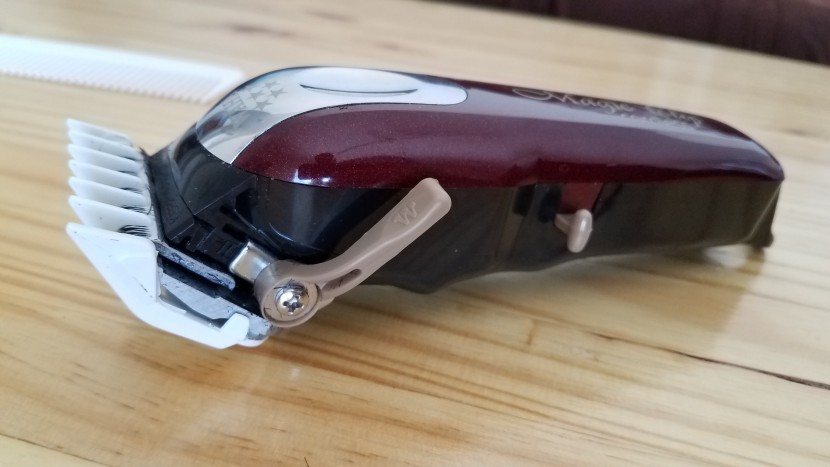 beard trimmer - a lever makes minor height adjustments within guard sizes.