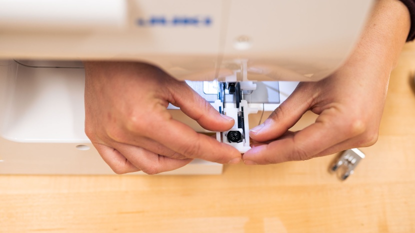 juki hzl-lb5100 - measuring the button to set the buttonhole function is simple -...