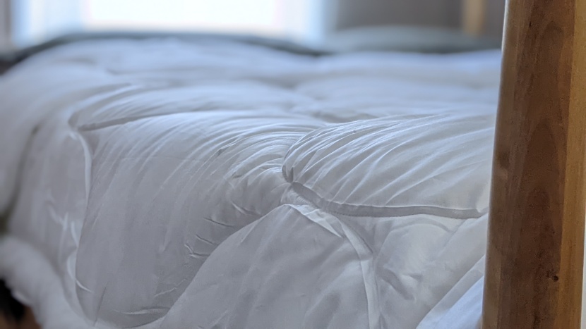comforter - though most folks use duvet covers, the feel of the fabric matters...