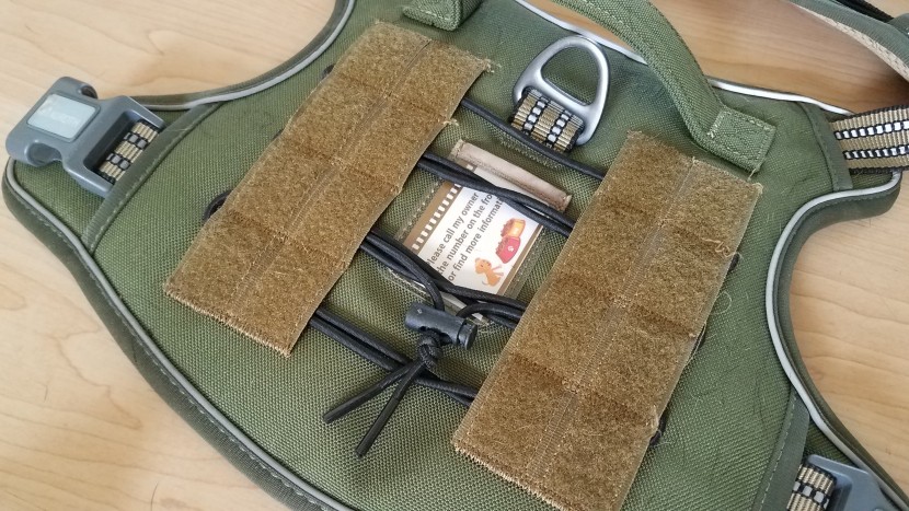 a bungy, hook and loop webbing, and molle/pals webbing, offer dog...