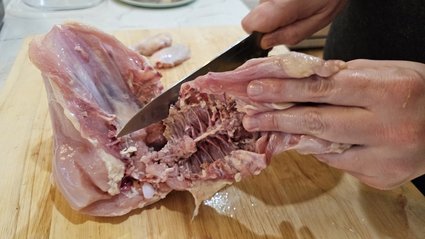 checking to see if each knife can handle breaking down a chicken...