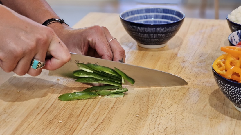 chef knife - the tojiro deftly cuts through some peppers.