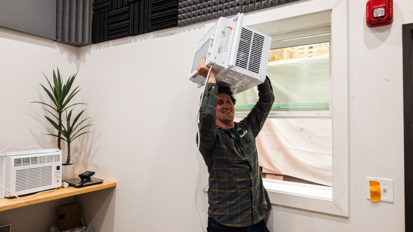 window air conditioner - smaller, lighter air conditioners are usually the easiest to lift...