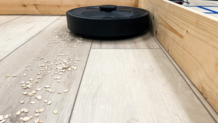 roborock q5 - the q5 getting right along an edge to pick up some spilled oatmeal.