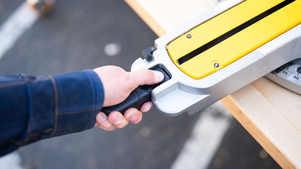miter saw - the dewalt dws780 foregoes the miter knob in favor of a trigger...