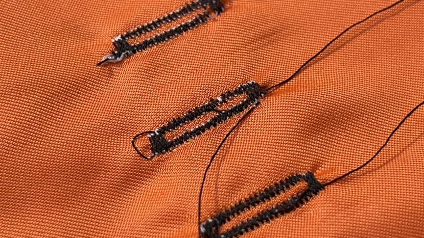 this buttonhole made by the hc1850 (center) is functional but it's...