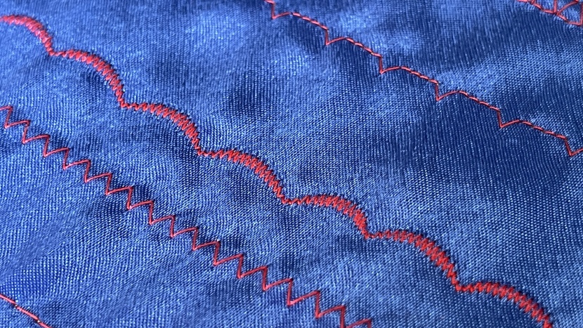 the front side of scalloped stitches (arched stitches in the center)...