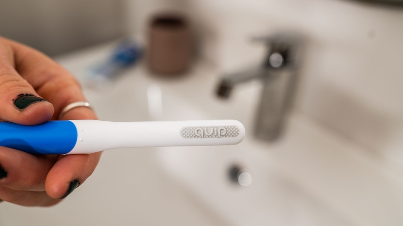 quip - the back of the quips brush head has a small rubber tongue scraper.