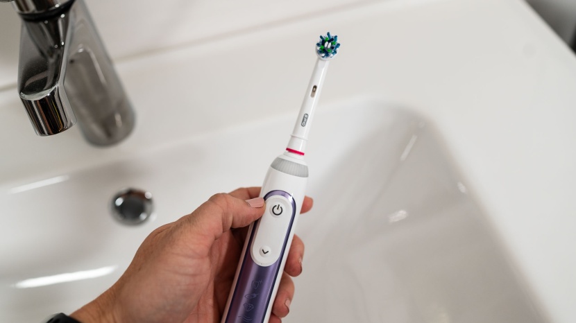 oral-b genius x - the smart ring lights up red if you&#039;re brushing too hard. most of...