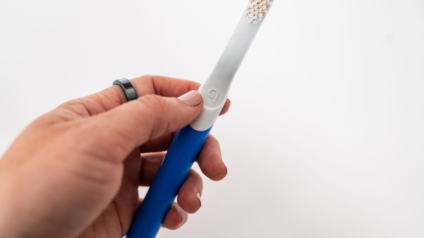 quip - the "q" is the single button that controls the toothbrush, simply...