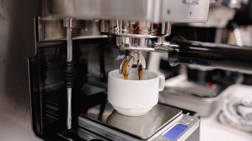 espresso machine - the final stages of pulling an espresso shot. liquid espresso is...