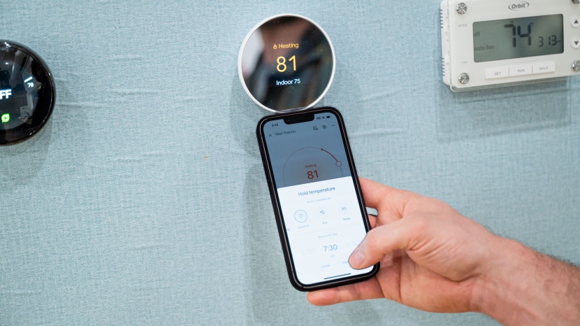 google nest thermostat - the interface of both the app and the thermostat is clean and...