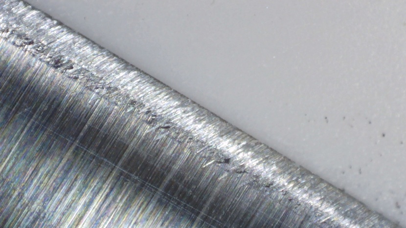 even though the abrasive marks along the secondary bevel are tilted...