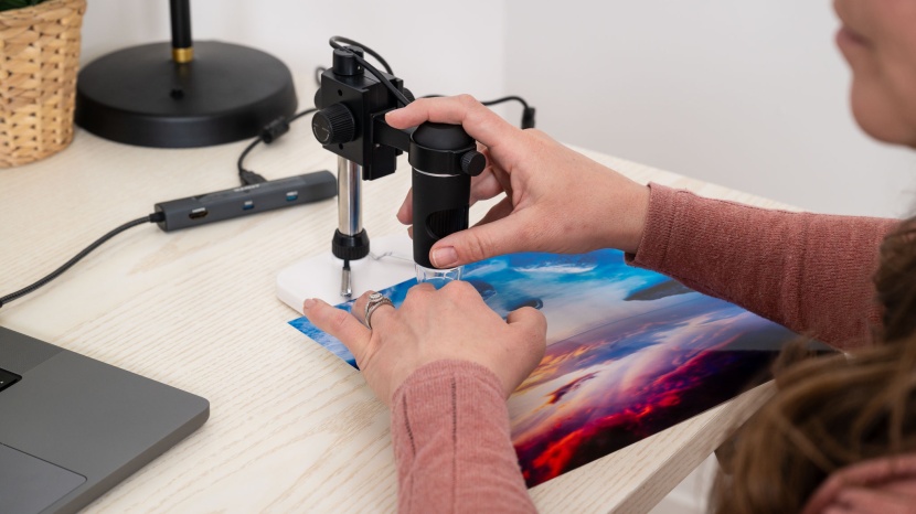 we closely analyzed each photo print under a microscope.