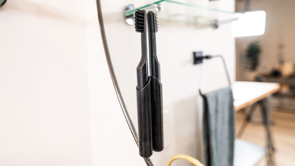 quip smart - the quip smart travel cover doubles as a mirror-mounted holder.