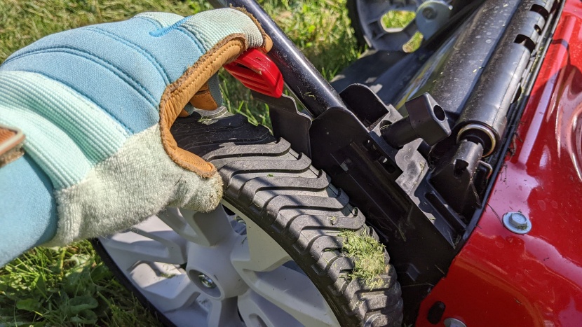 this lever lets you adjust the mowing height. there is one on the...