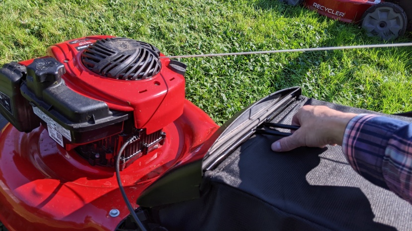 after you flip up the door to allow grass to exit the back of the...