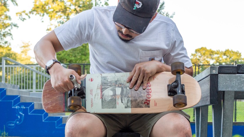 loosening the trucks of the arbor pilsner cruiser hybrid complete.