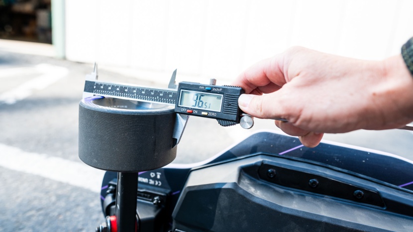 we use calipers to precisely measure each board's wheel width.